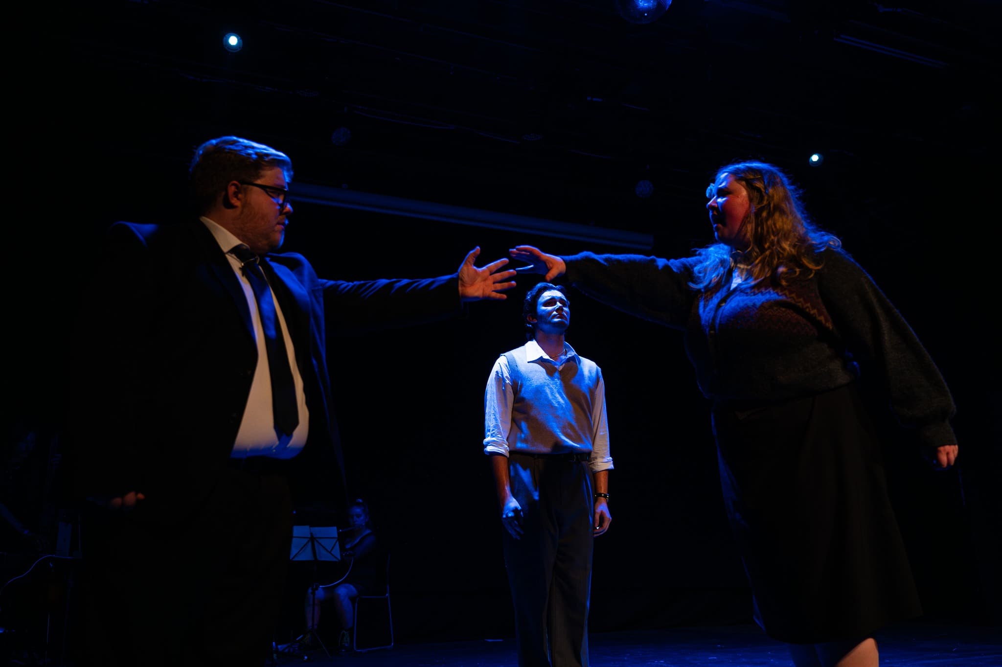 Dramatic theatre stage with innovative lighting and performers